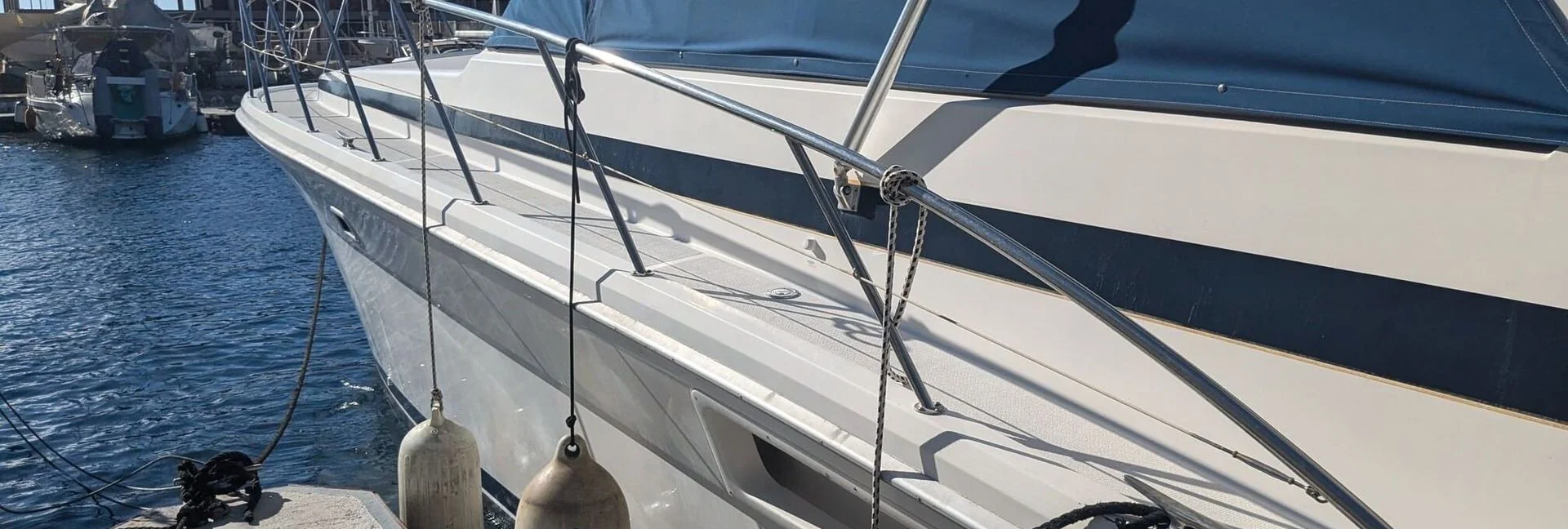 Moored sailboat with rigging and fenders at St. Petersburg waterfront dock.
